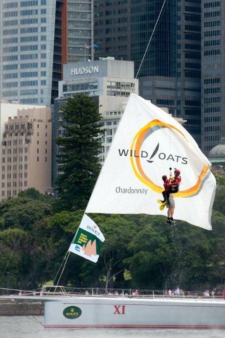 Going up! A simulated rescue operation for Rolex Sydney Hobart race record holder, Wild Oats XI, sees a crewman winched to safety by the Westpac Life Saver Rescue Helicopter on Sydney Harbour today. - Rolex Sydney Hobart Yacht Race 2011 ©  Andrea Francolini Photography http://www.afrancolini.com/